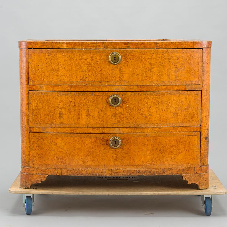 A bureau veneered in Karelian birch, mid-19th century.