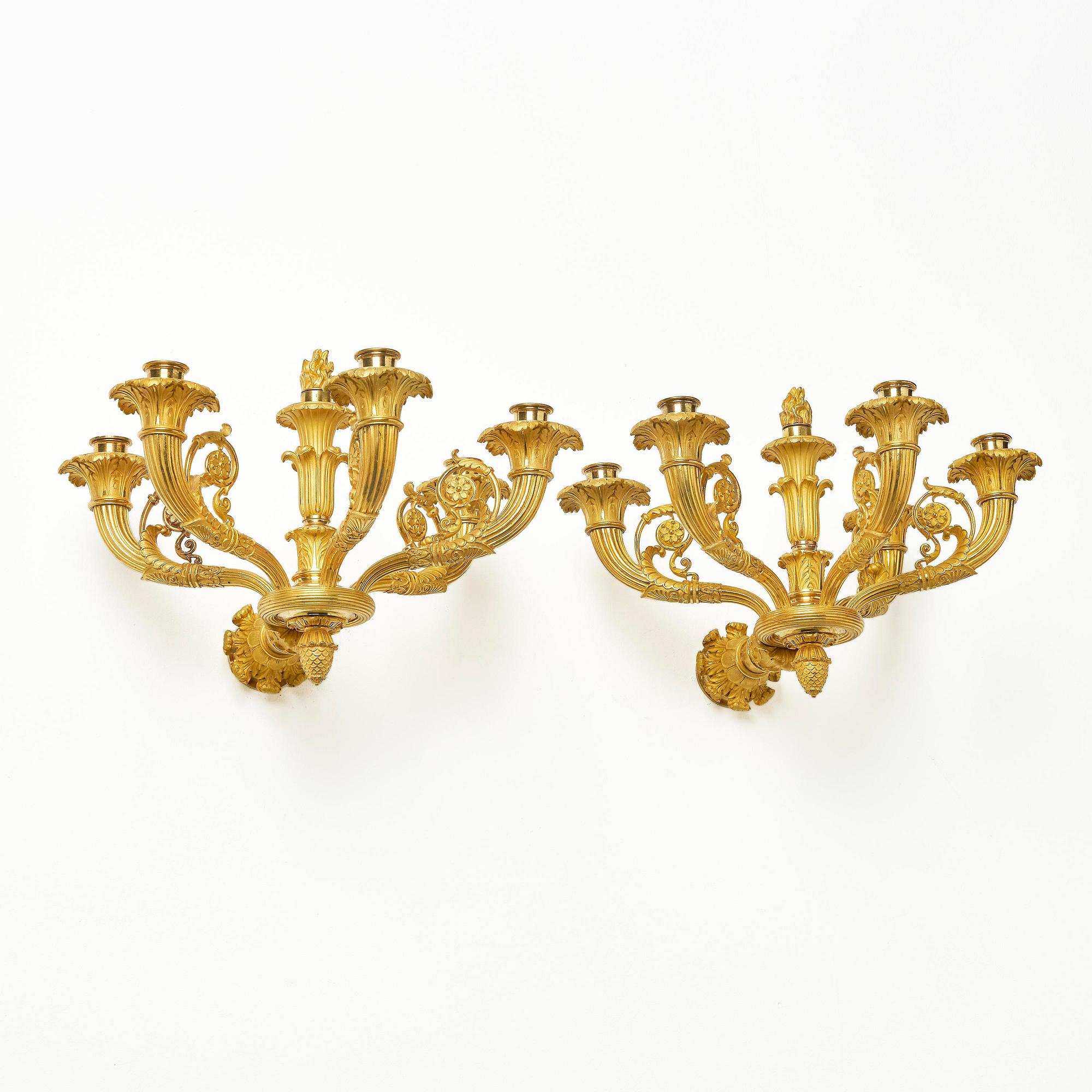 A pair of French Empire six-branch ormolu appliques, ca 1820's.
