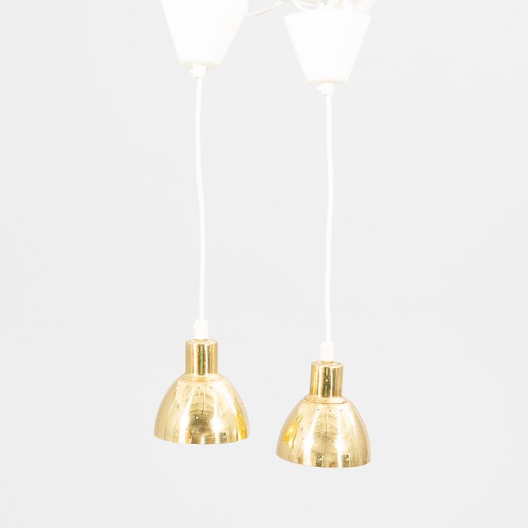 A pair of Hans-Agne Jakobsson brass ceiling pendants.