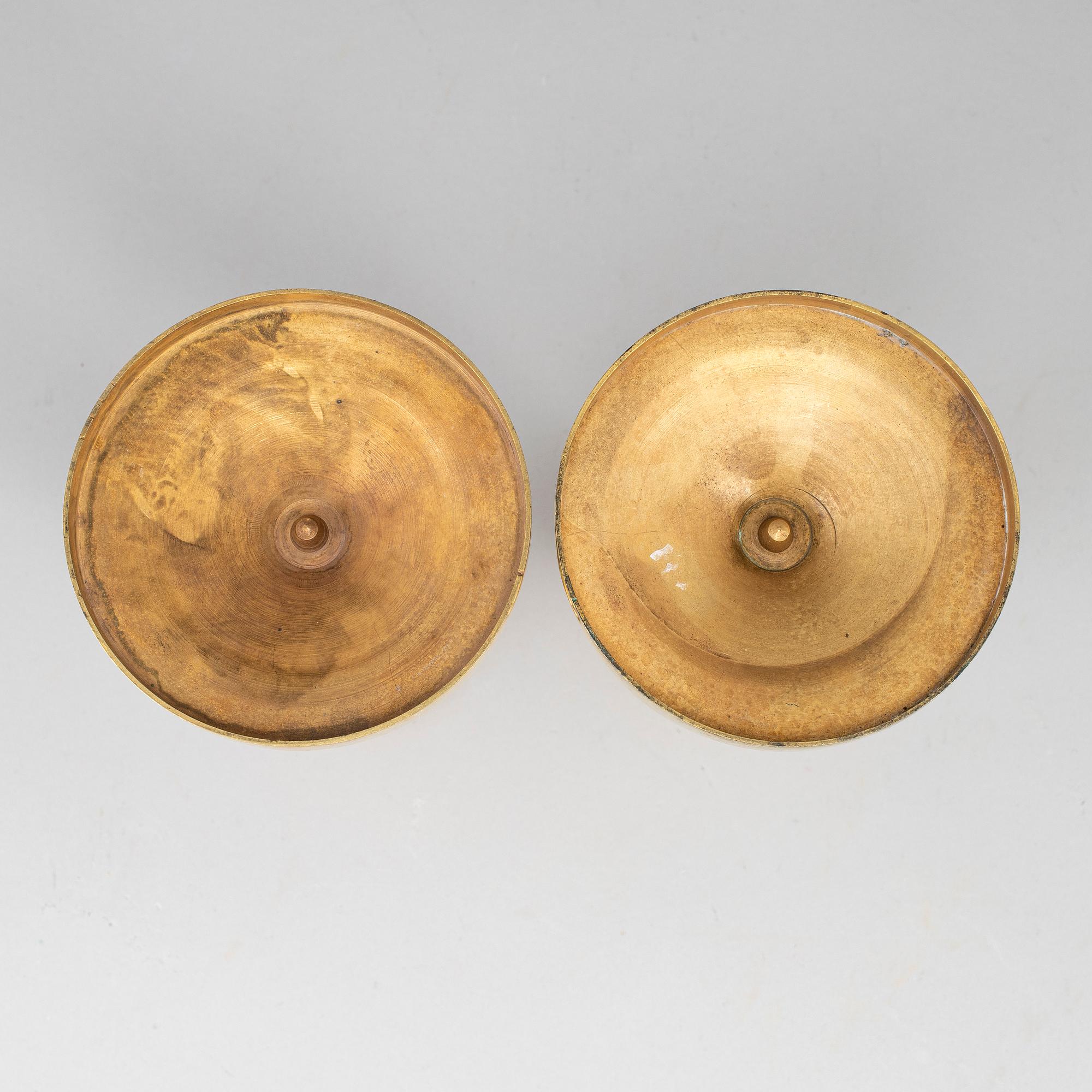 A pair of empire, ormolu candlesticks, first half of the 19th century.