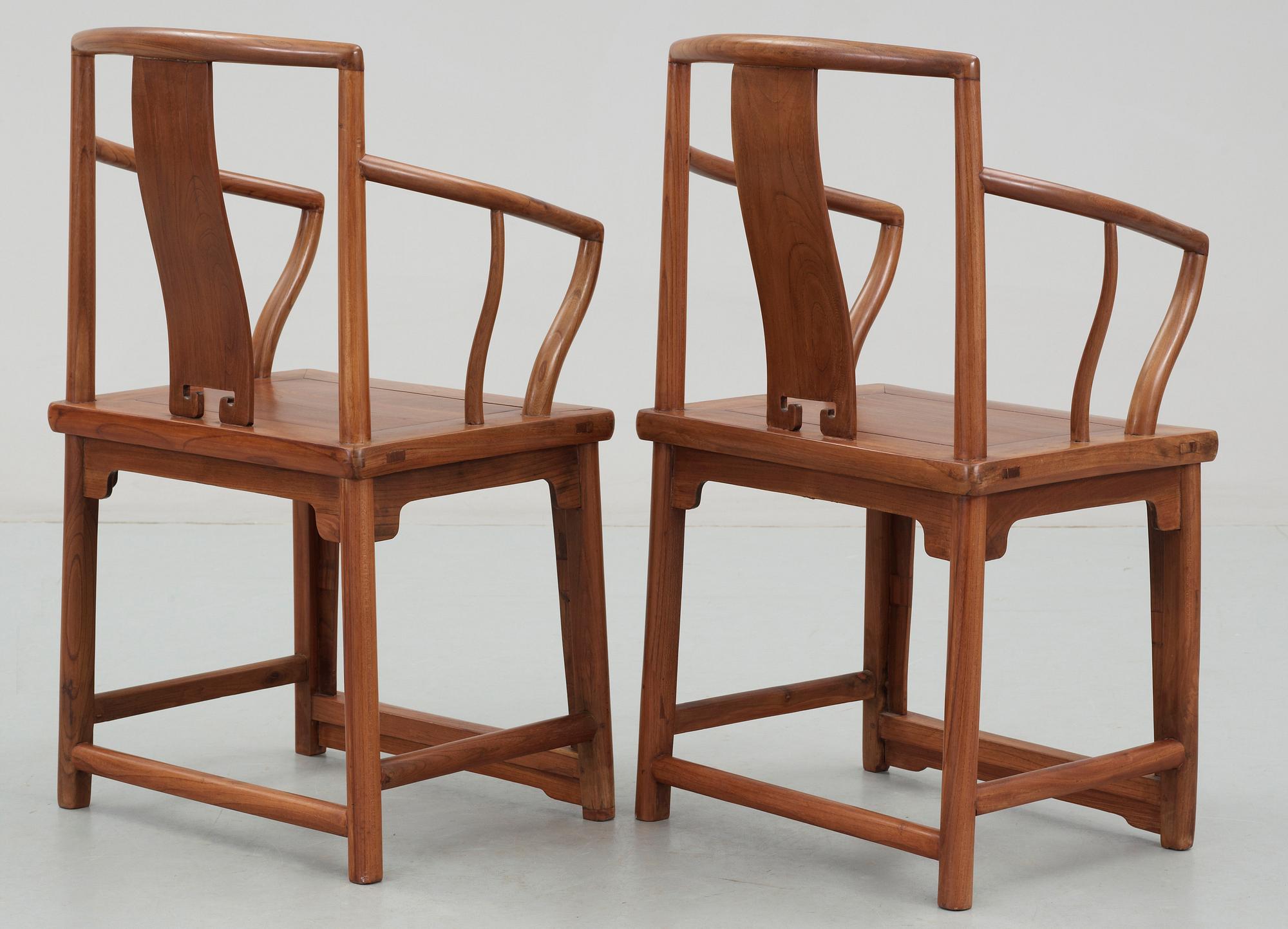 A pair of hardwood armchairs, Qing dynasty.
