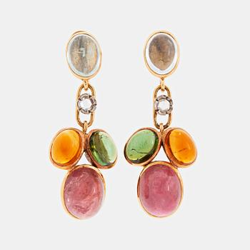 A pair of WA Bolin earrings.