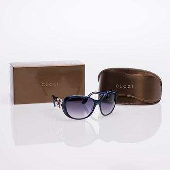 AURINKOLASIT, Gucci.