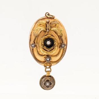 Pendant photo locket in 8K gold and silver.