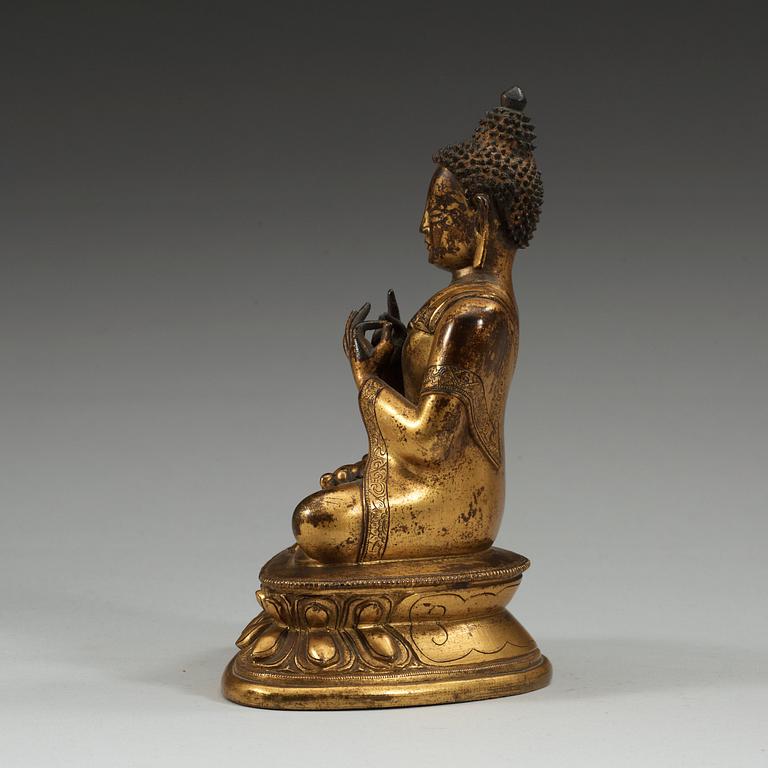 A gilt bronze figure of Buddha, Sinotibetan, 18th Century.