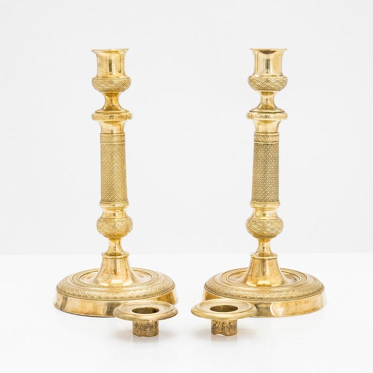 A pair of early 19th century French gilded Empire candlesticks.