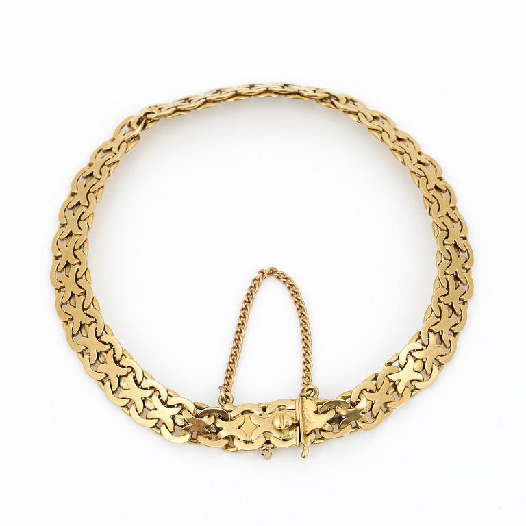 ARMBAND, 18K guld, Thulins Eftr Urhandels, Stockholm, 1936. Vikt ca 13,45 g.