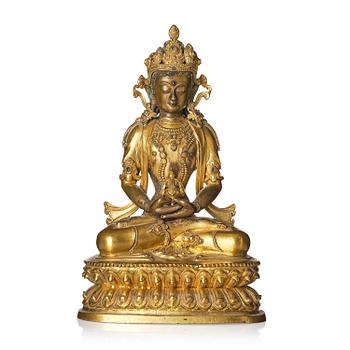 907. A gilt copper alloy figure of Amitayus, Tibet, 17th/18th century.