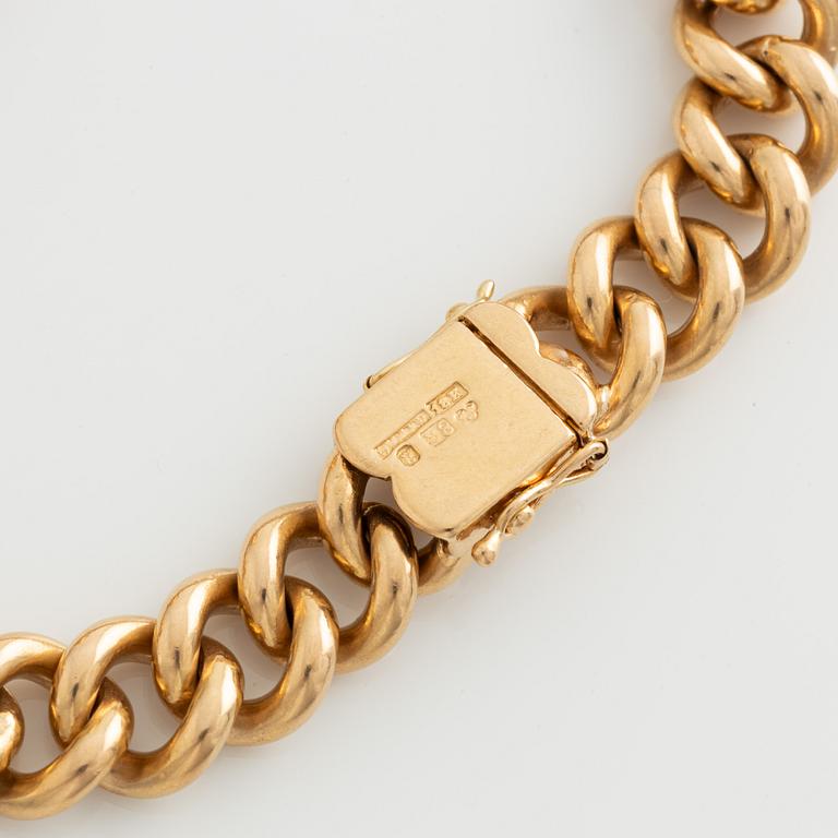 Bracelet, 18K gold with two large charms.