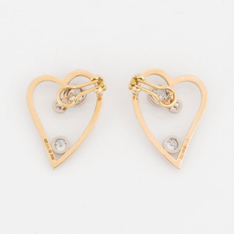 WA Bolin a pair of earrings in 18K gold and white gold set with round brilliant-cut diamonds.