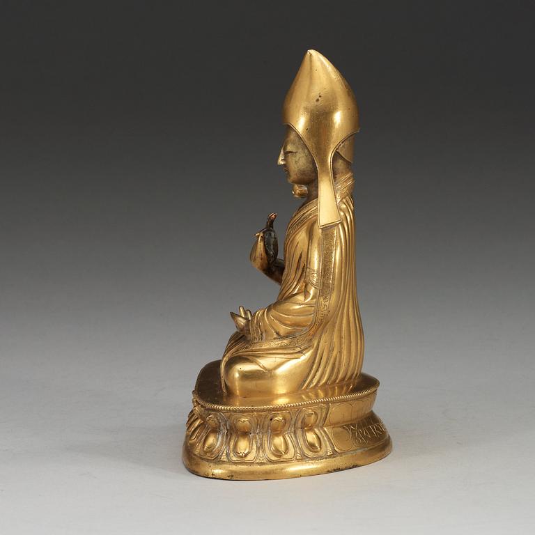 A gilt bronze figure of Seventh Dalai Lama, Lobzang Kalzang Gyatso, Qing dynasty (1644-1912).