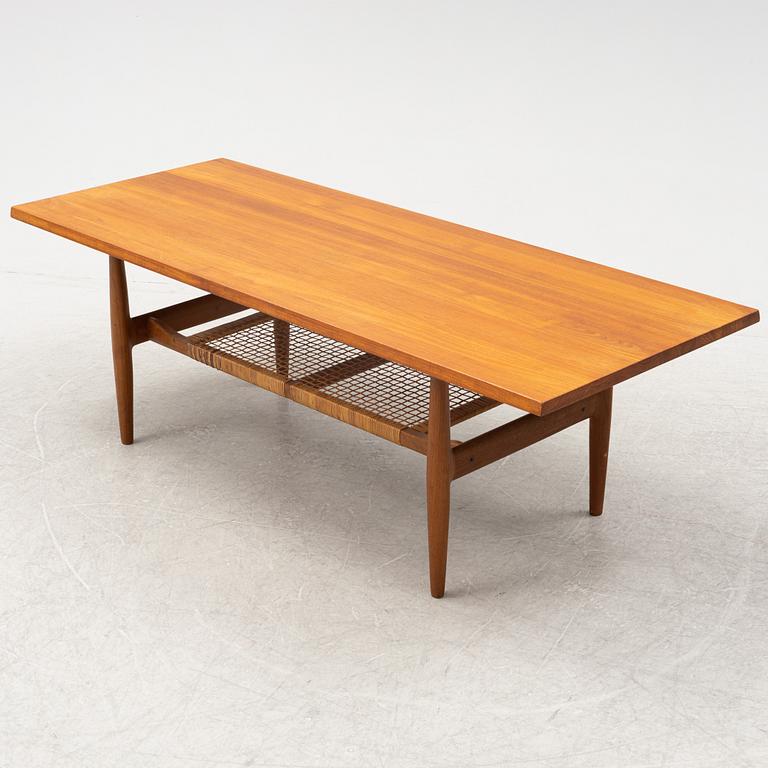 A composite teak coffee table with a rattan shelf, Denmark, 1950/60s.