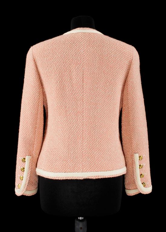 A pink/white bouclé jacket by Chanel.