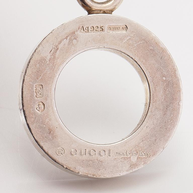 Gucci, A pair of earrings, bracelet, ring and necklace made of sterling silver. Marked Gucci, Made in Italy.