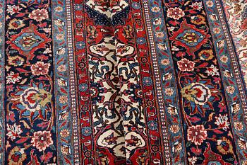 A semi.antique Kashan, c. 319 x 212 cm.