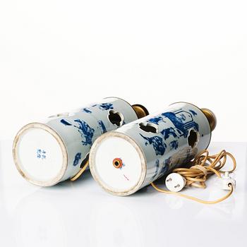 A pair of blue and white vases made in to lamps, late Qing dynasty, 19th Century.