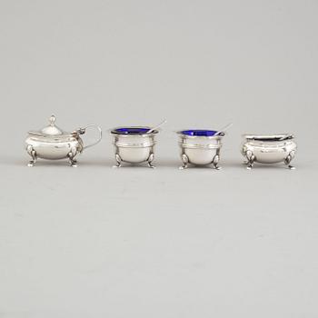 A silver four part condiments set from Birmingham, England, 1919-51.