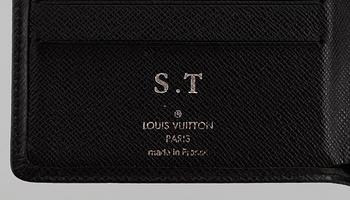 LOUIS VUITTON, black taiga leather wallet.