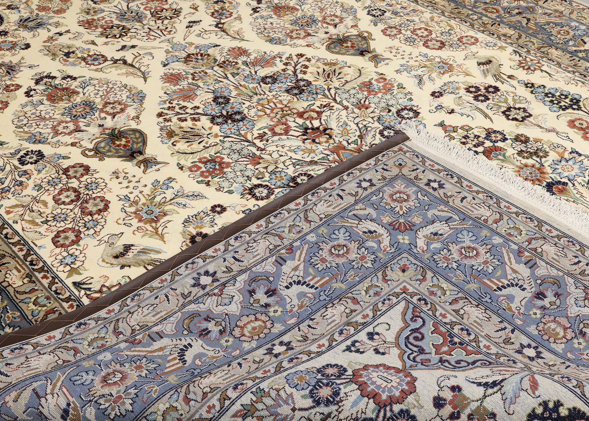 A Shareza carpet, signed, approx. 358 x 254 cm.