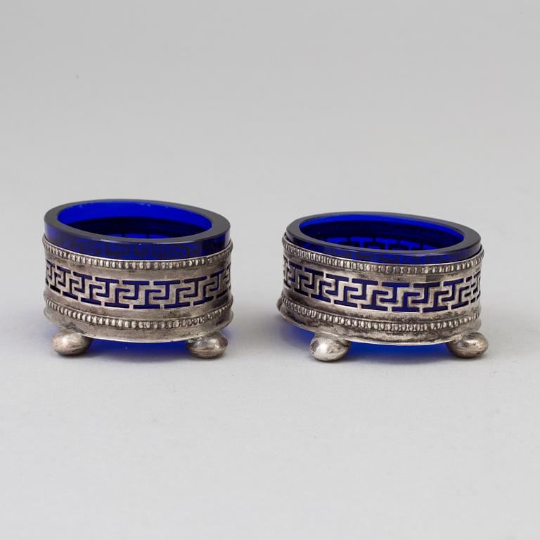 A Pair Of Neoclassical Silver And Glass Salt Cellars, early 20th century.