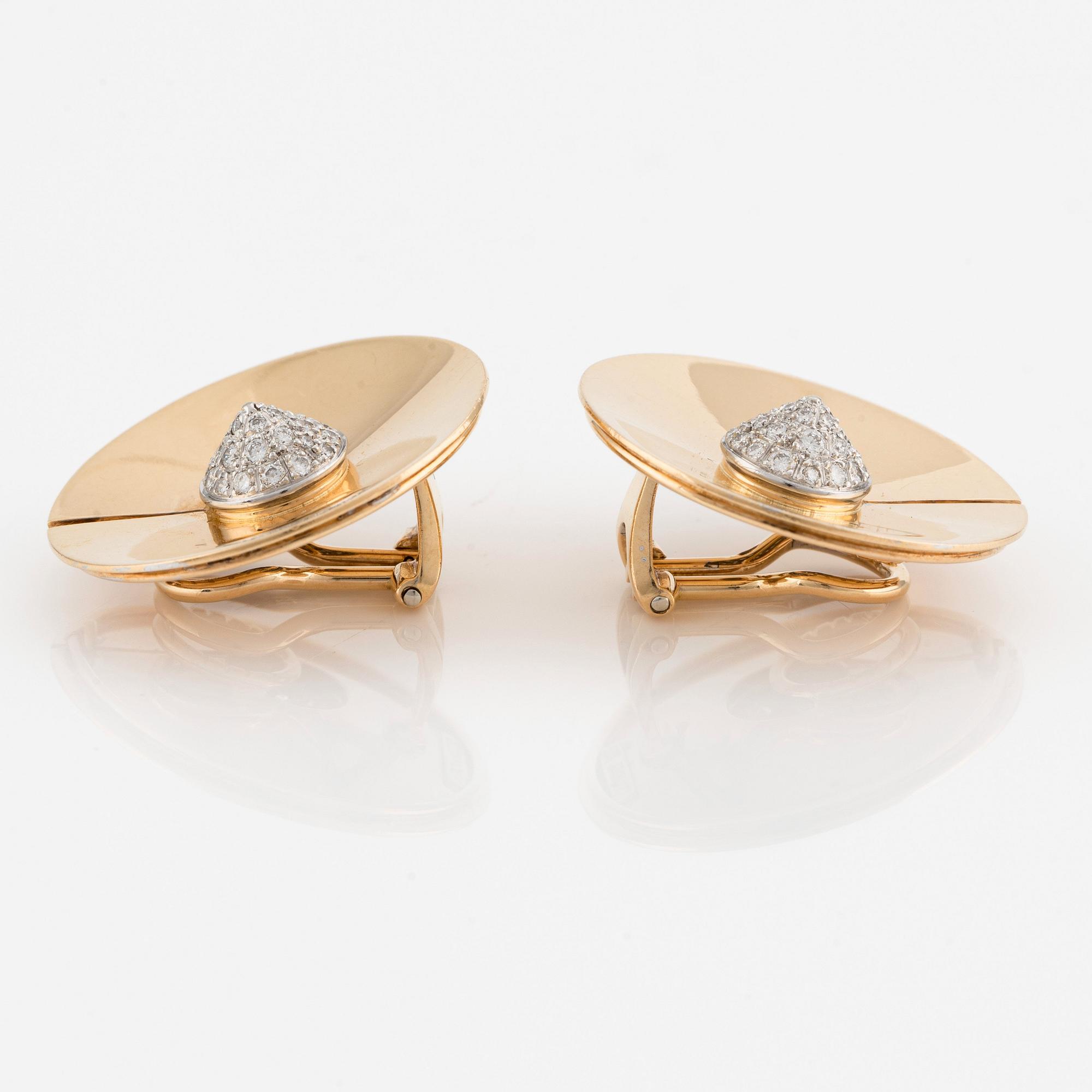A pair of 18K gold Trudel earrings set with round brilliant-cut diamonds.