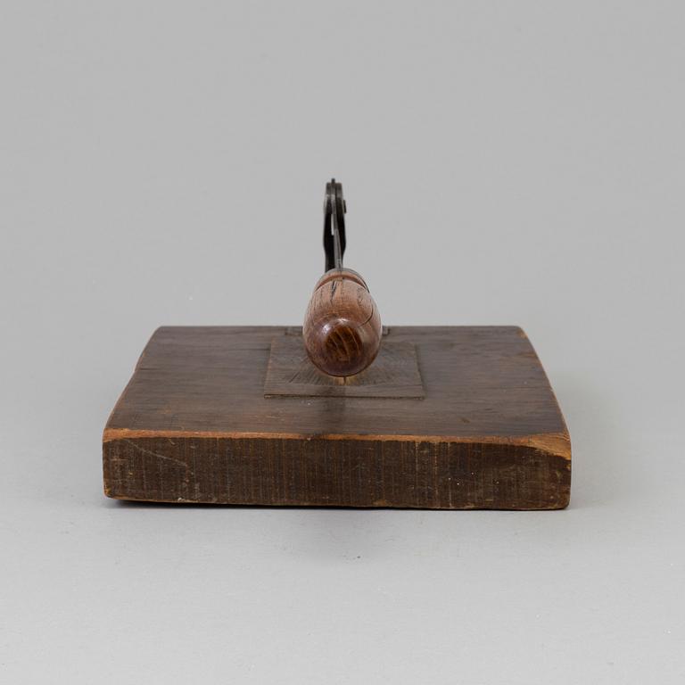 A 19TH CENTURY TOBACCO CUTTER, wood and iron.