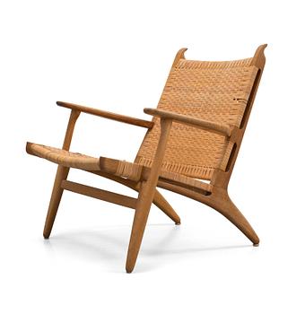 33A. Hans J. Wegner, A Hans J Wegner 'CH-27' oak and rattan easy chair, Carl Hansen & Son, Denmark.