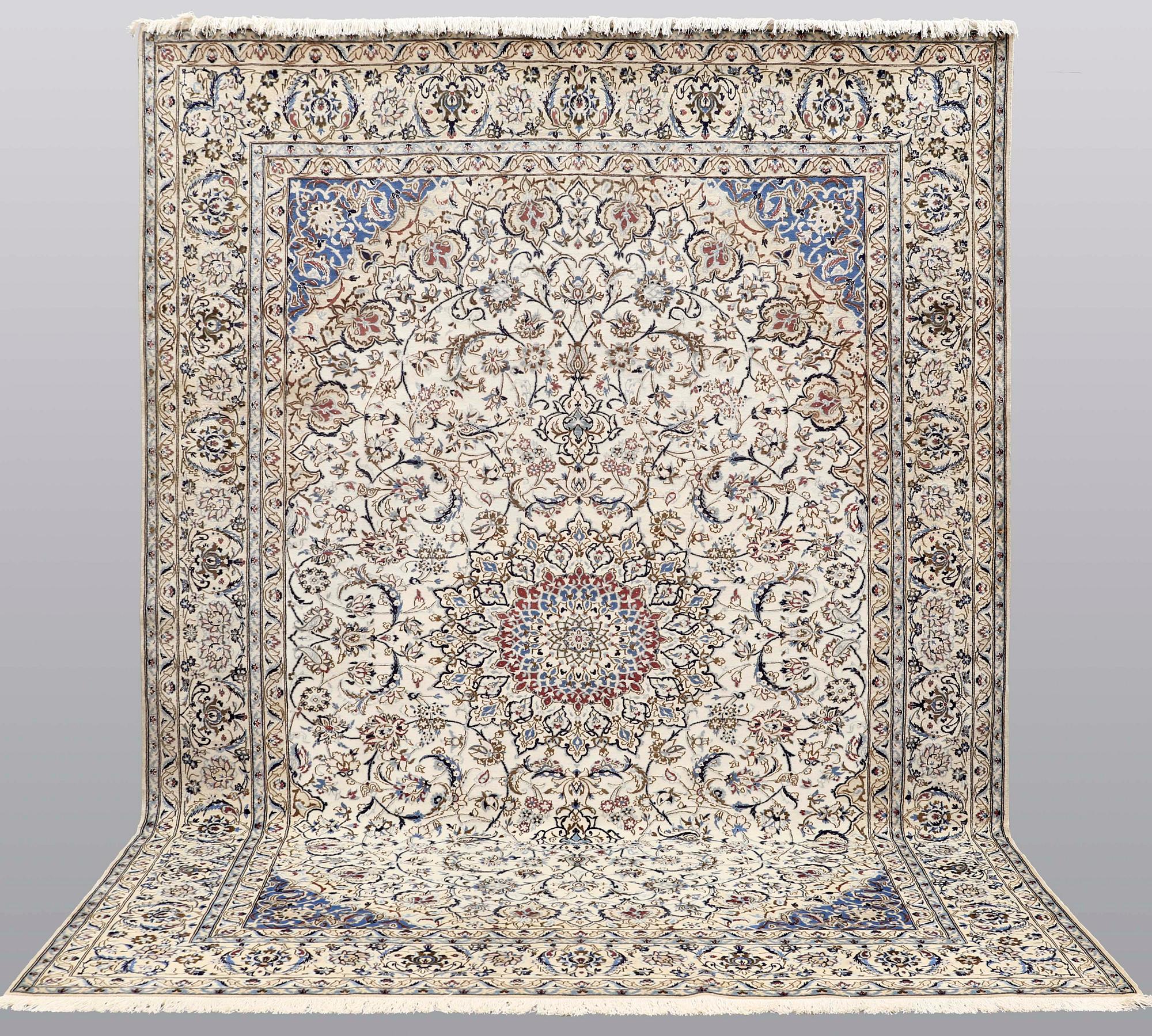 A carpet, Nain part silk, 364 x 256 cm.