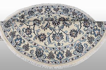 A rug, Nain, part silk, ca 146 x 146 cm.