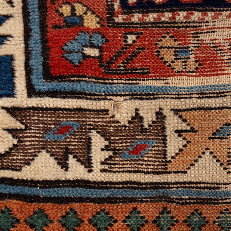 A antique Kazak gallery carpet, ca 310 x 105 cm.
