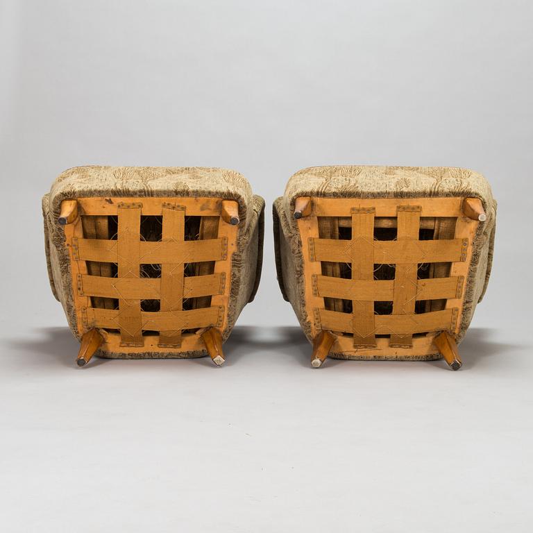 A pair of 1950s armchairs.