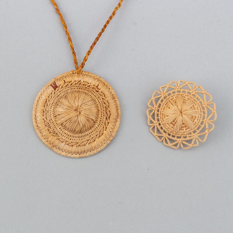 A Sami root brooch and pendant.