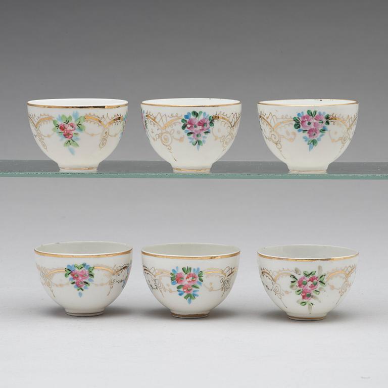 A set of six Ottoman parcel-gilt silver Xarfs with Russian Kuznetzov porcelain cups, c. 1910.