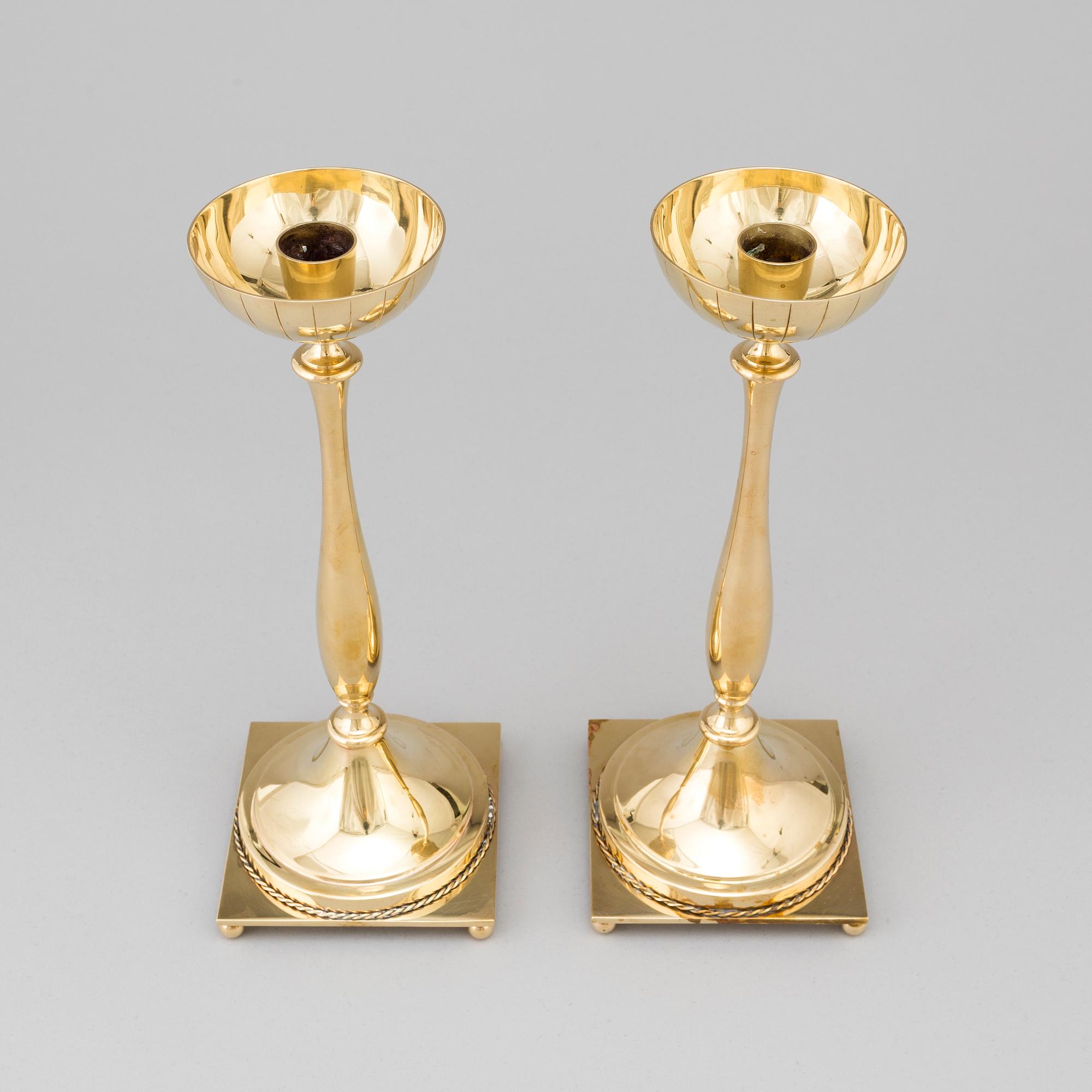 A pair of mid 20th century brass candlesticks by Gunnar Ander for Ystad Metall.