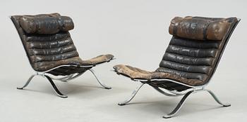 A pair of Arne Norell "Ari" black leather and steel easy chairs by Norell Möbel AB, probably 1960-70's.