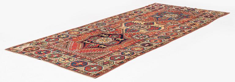 An antique Konya long rug, c. 324 x 144 cm.