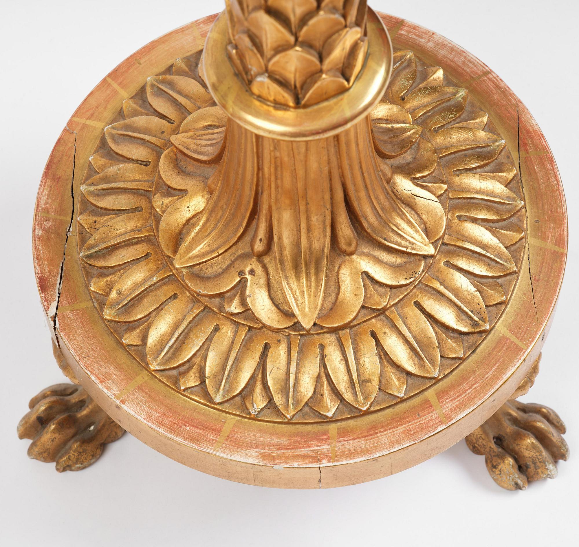 A pair of late Gustavian giltwood torchères by J. Frisk (master in Stockholm 1805-24).