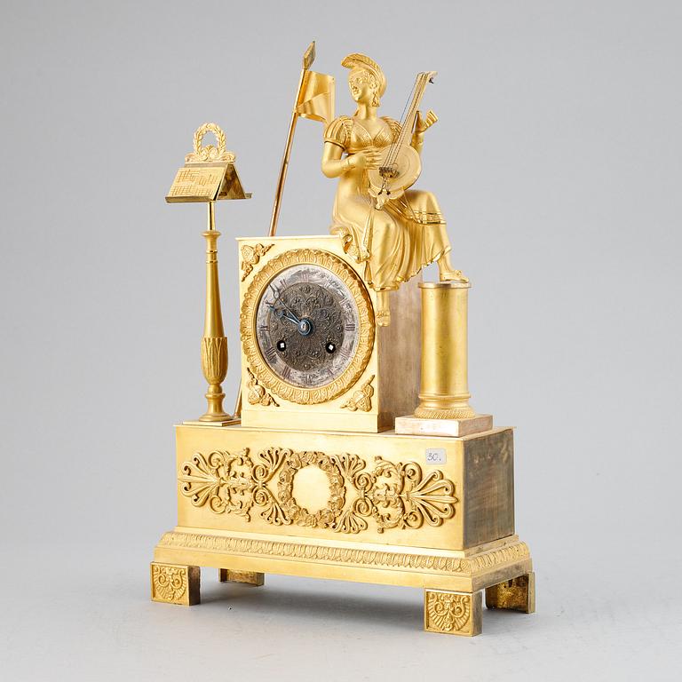 A French Empire gilt bronze mantel clock, early 19th Century.