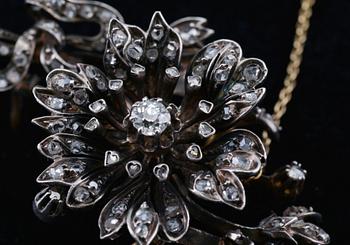 RINTANEULA, keskikivi vanhahiontainen timantti n. 0.35 ct. 118 pieniä ruusuhiottuja timantteja. Hopeaa ja 18K kultaa.