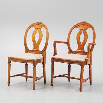 A Gustavian style dining table with two armchairs and four chairs, late 20th century.