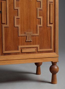 A Swedish Grace mahogany showcase cabinet, reportedly a win at the Stockholm Cabinetmaker's association lottery, 1920's.