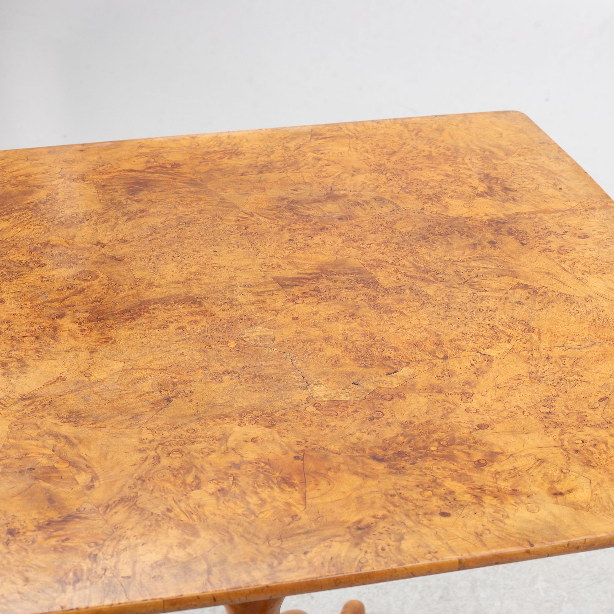 A burr alder tilt-top table, Mälardalen, circa 1800.