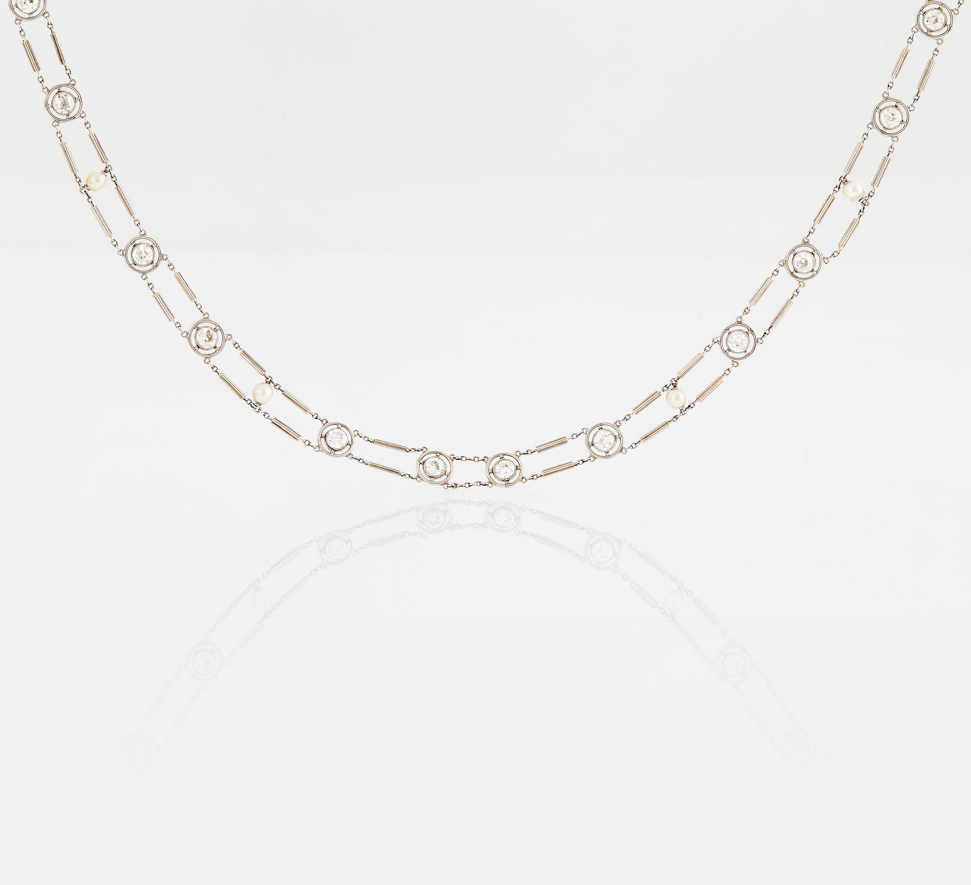 A NECKLACE with round brilliant-cut diamonds and pearls.