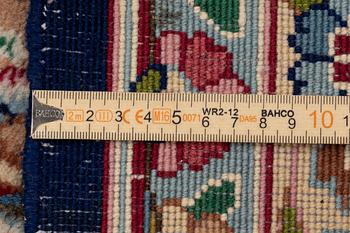 An oriental carpet, c. 385 x 300 cm.