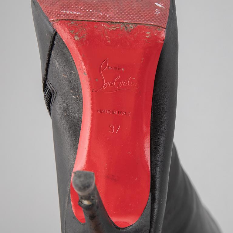 CHRISTIAN LOUBOUTIN, a pair of leather boots, size 37.