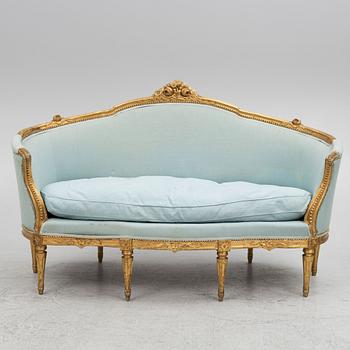 A sofa and a pair of chairs, Louis XVI style, circa 1900.