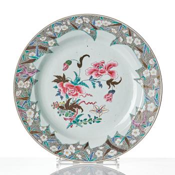 A famille rose serving dish and six dinner plates, Qing dynasty, Qianlong (1736-95).