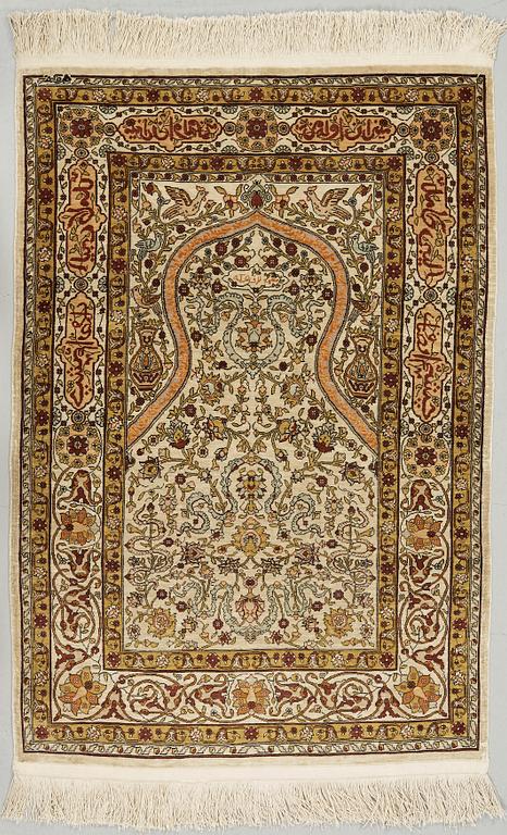 A silk Hereke possibly, around 96 x 66 cm.