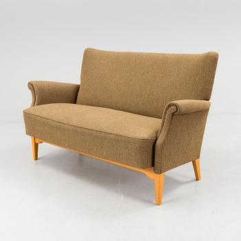 A 1940s  Dux sofa.