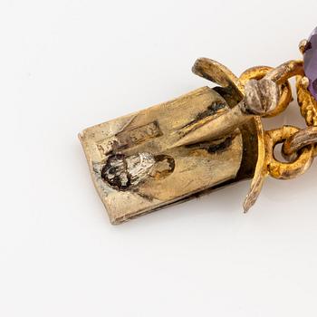 A necklace and a bracelet of gilded silver with faceted amethysts.